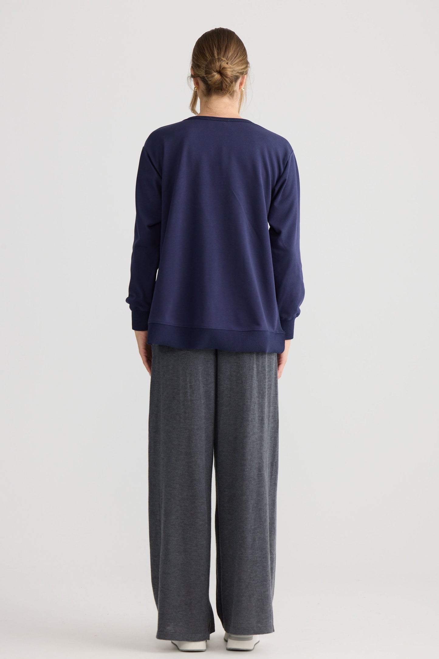 Faye Lounge Jumper in navy, shown on model.