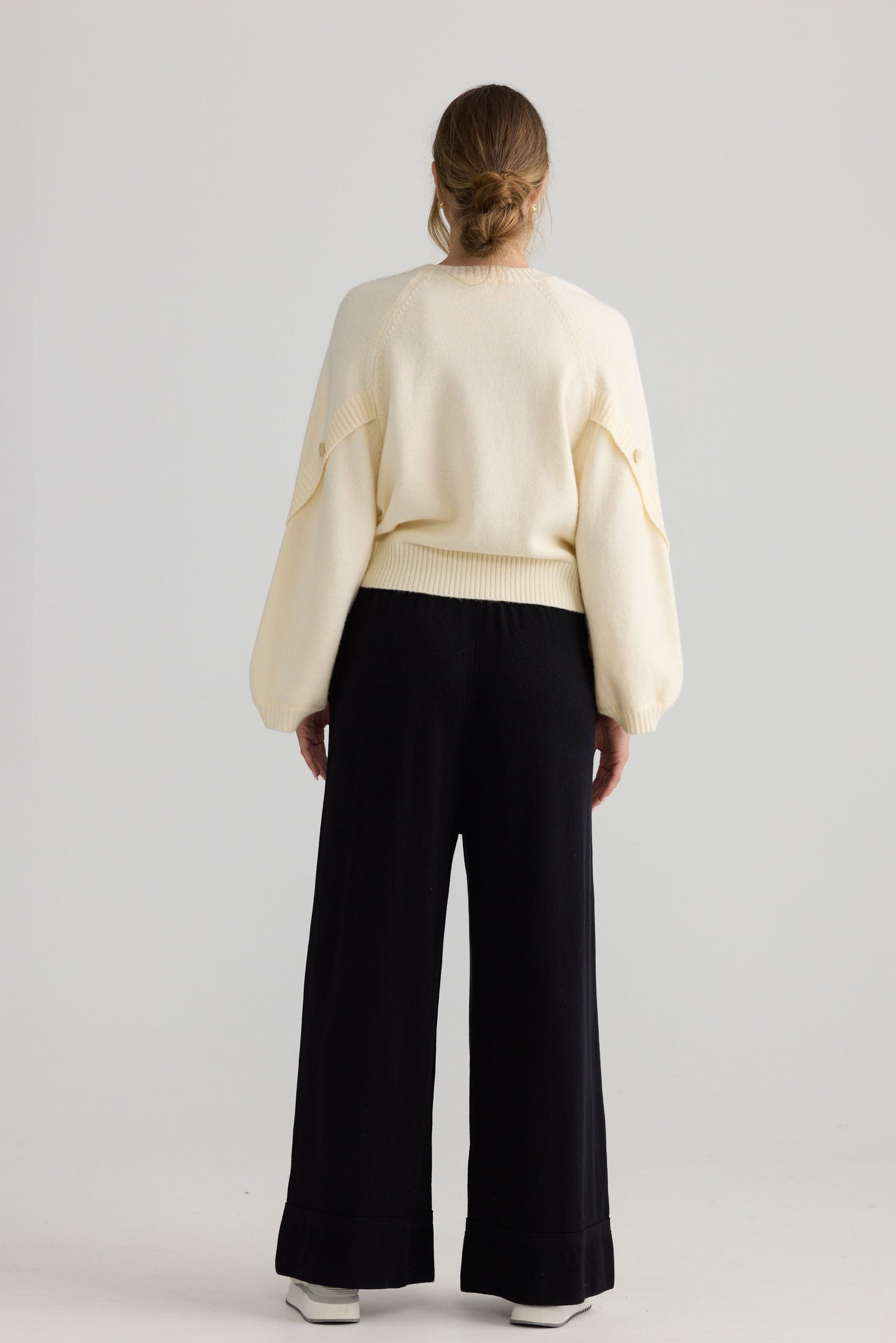Model wearing Awaken Knit Pant in black.