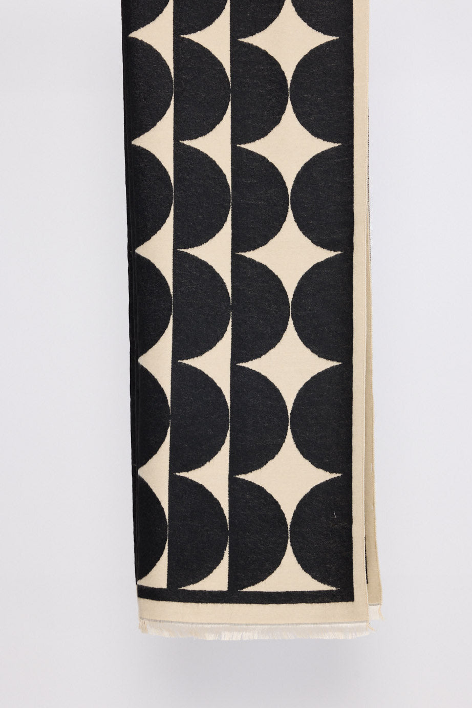 Paloma Scarf - Black scarf in black with geometric weave, front view on white background