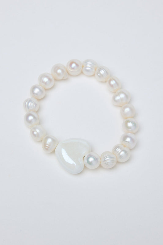 Pearl bracelet on a light gray background
