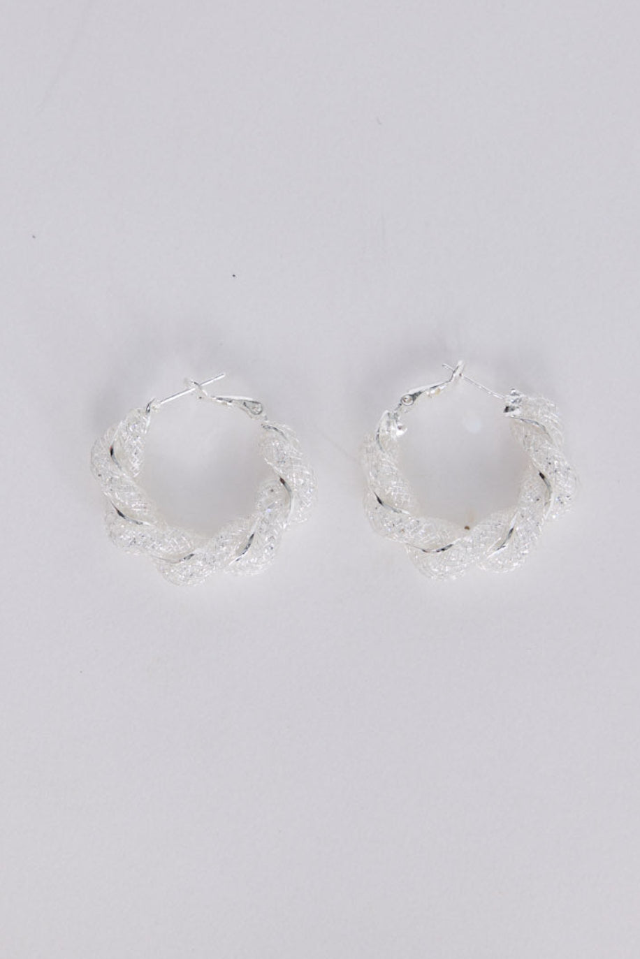 Opulence Earrings in silver with soft textured finish, front view on white background