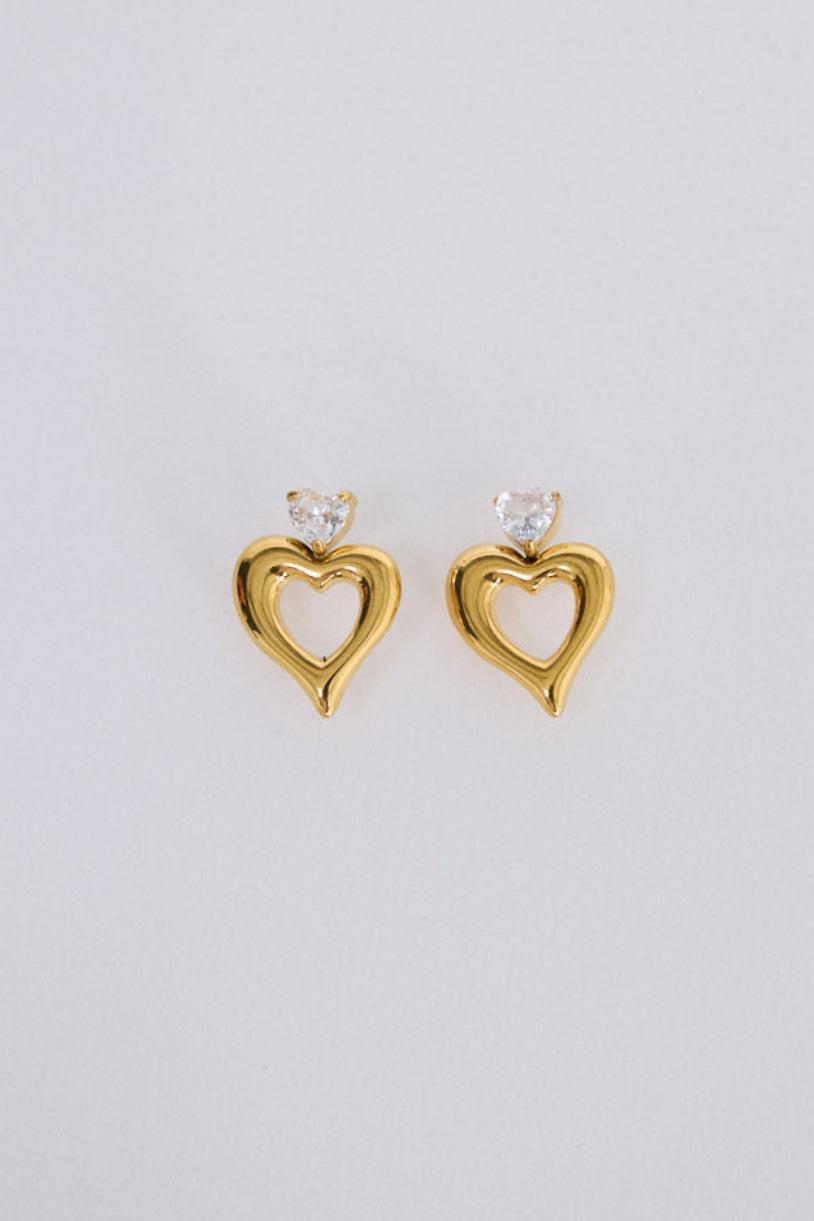 Beloved Earrings in gold with a soft sculptural finish, angled view on white background