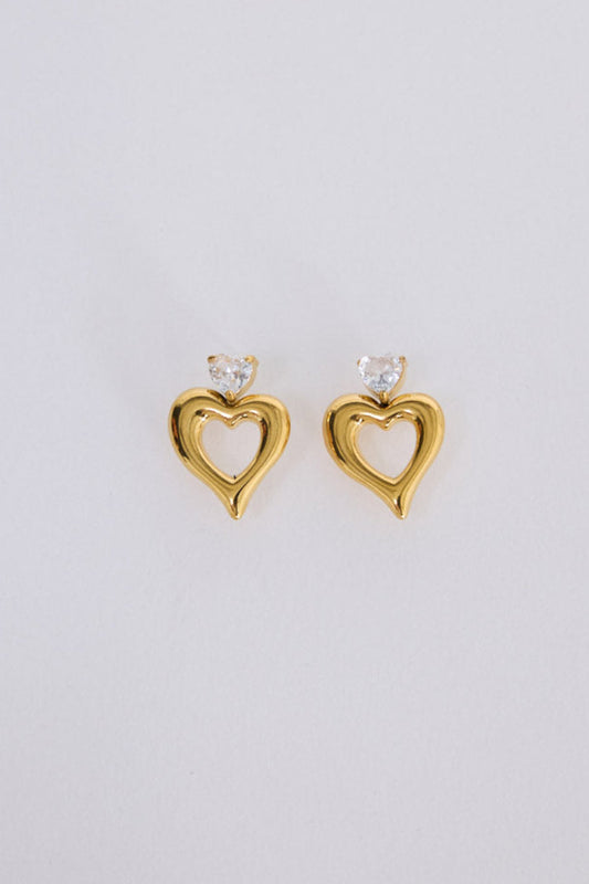 Beloved Earrings in gold with a soft sculptural finish, angled view on white background
