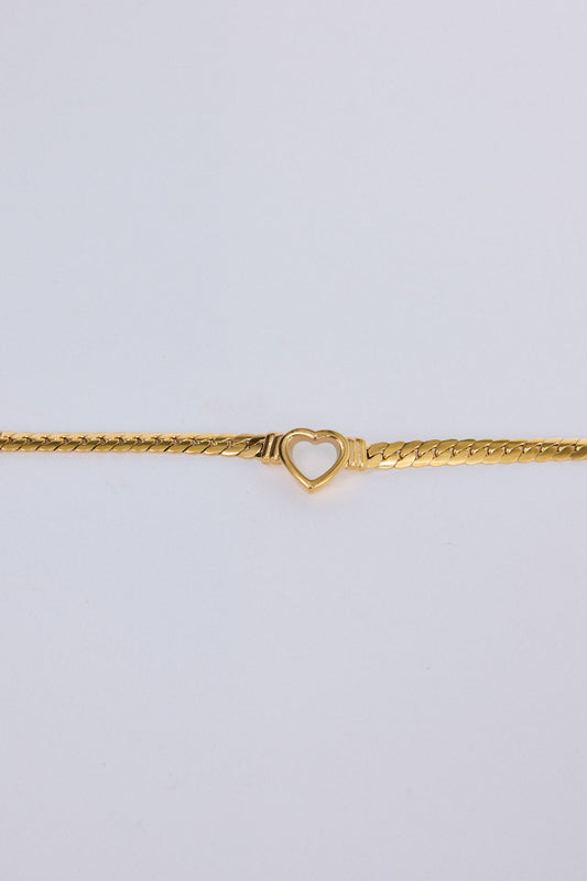 Hearts Bracelet in gold with delicate heart link detailing, flat lay detail view on white background