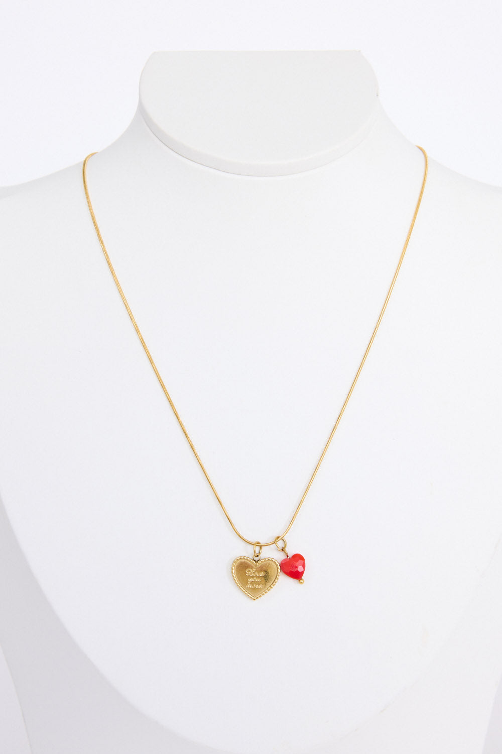 Love You More Necklace in gold with heart charm detailing, angled view on white background