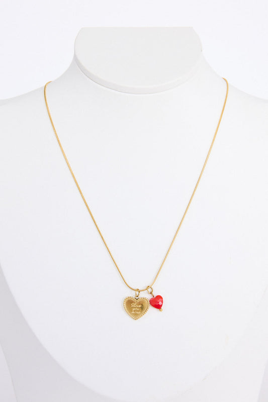 Love You More Necklace in gold with heart charm detailing, angled view on white background