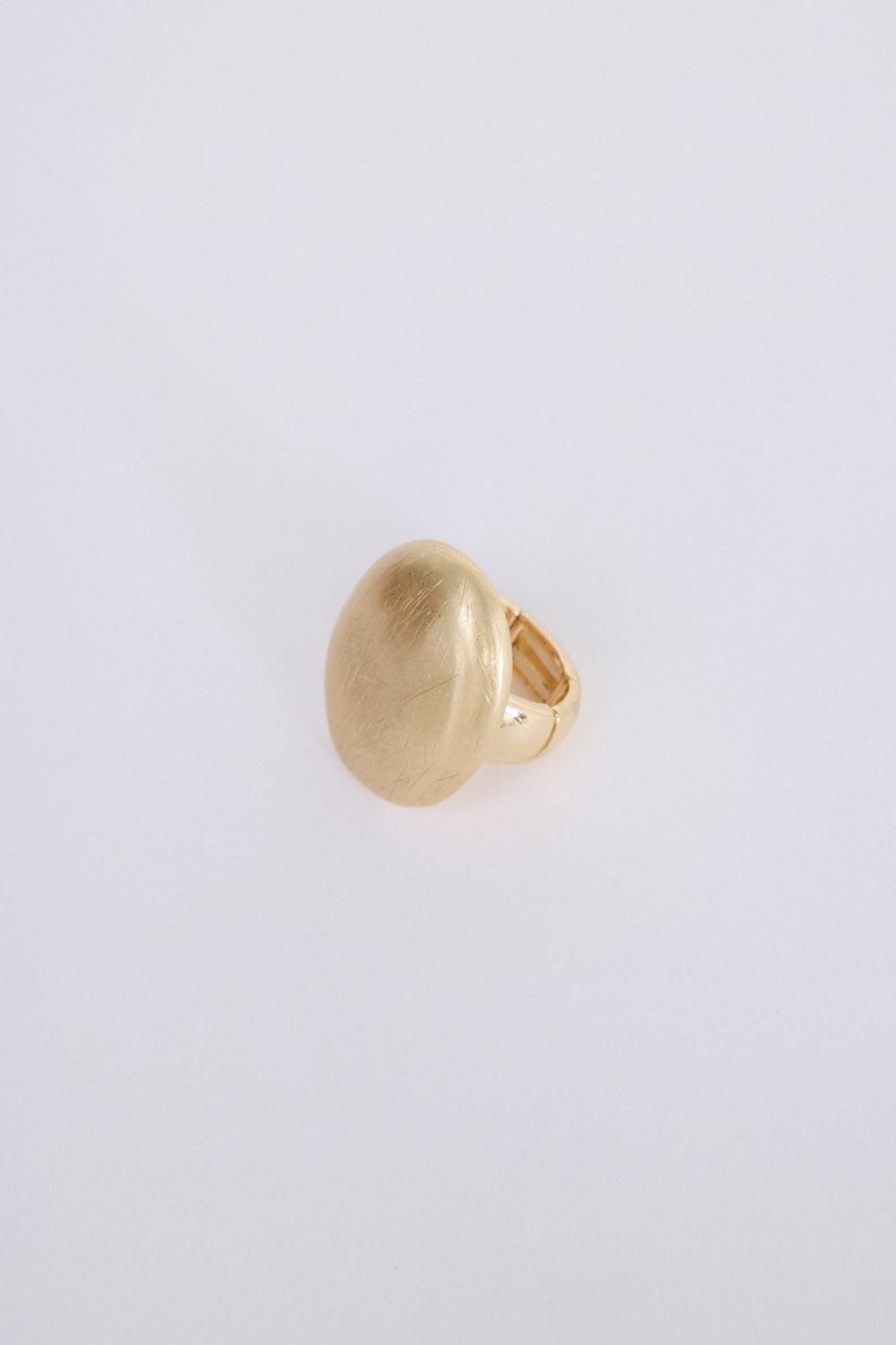 Nola Ring in gold with smooth domed face and brushed texture finish, front view on white background