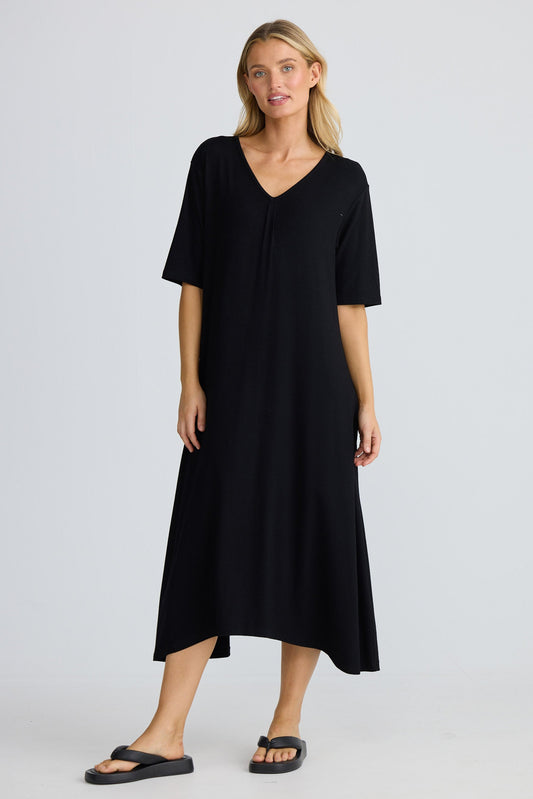 Woman wearing a black dress on a white background