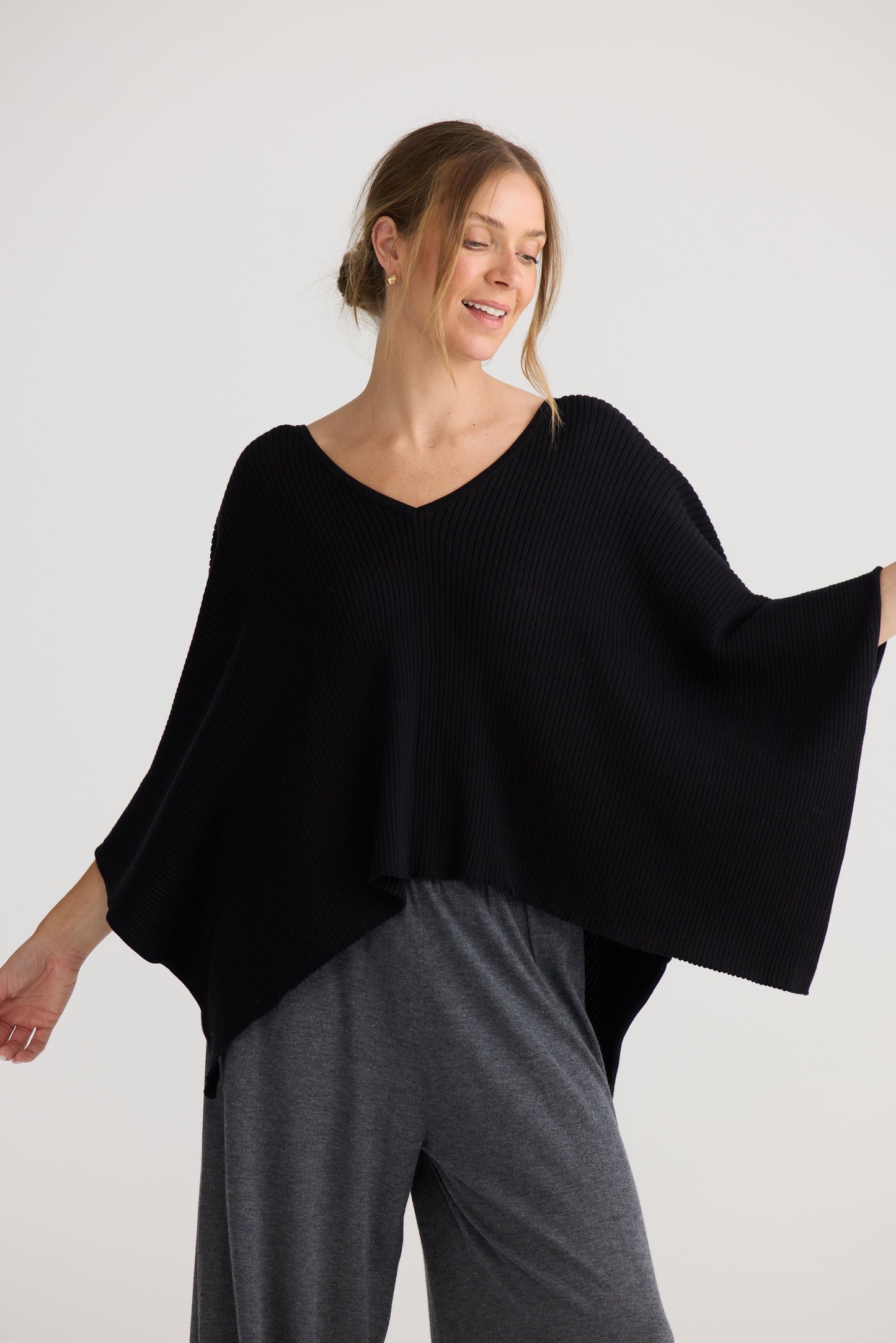 Affirm Cape in black, shown on model.