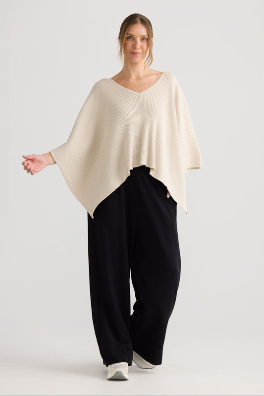 Affirm Cape in cream, shown on model.