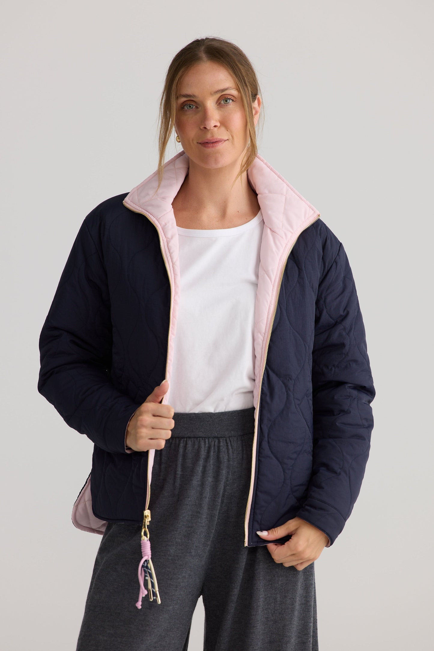 Ellis Puffer in navy with pink, shown on model.