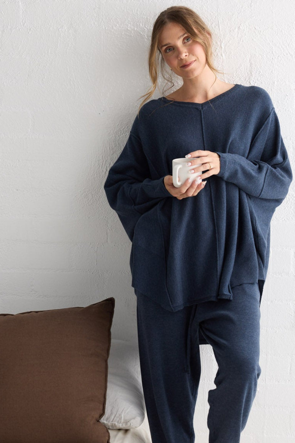 Campaign image of model wearing Chill Top in navy.