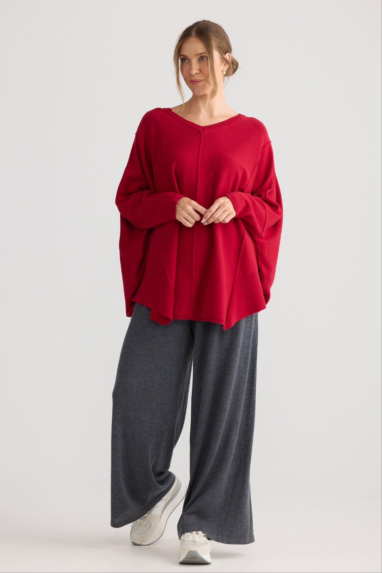 Model wearing Chill Top in scarlet, showing v-neckline.