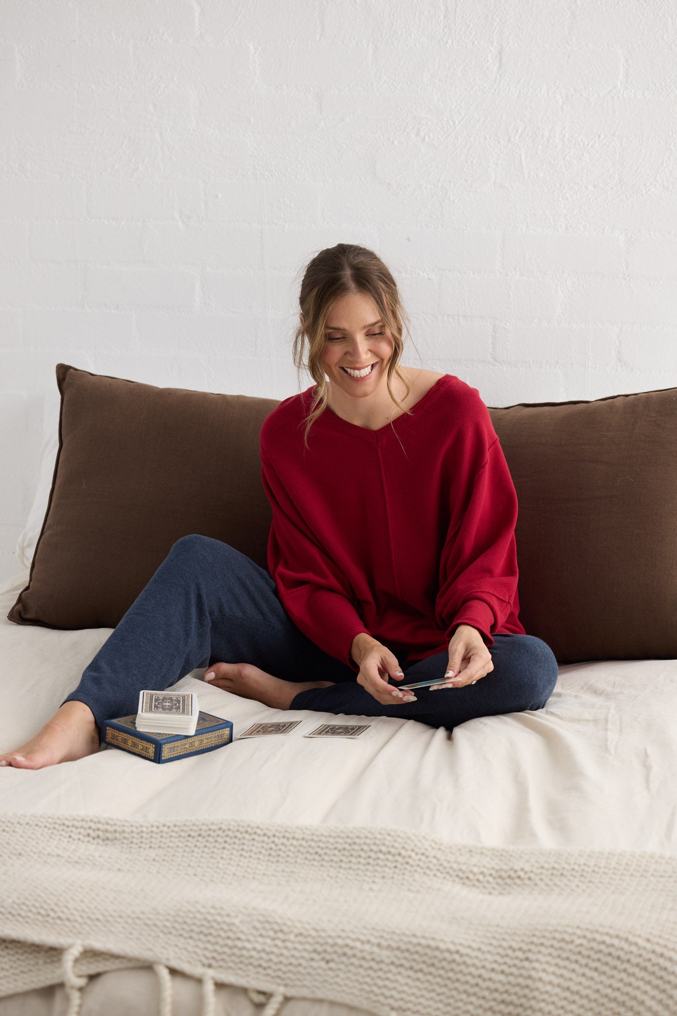 Campaign image of model wearing Chill Top in scarlet.