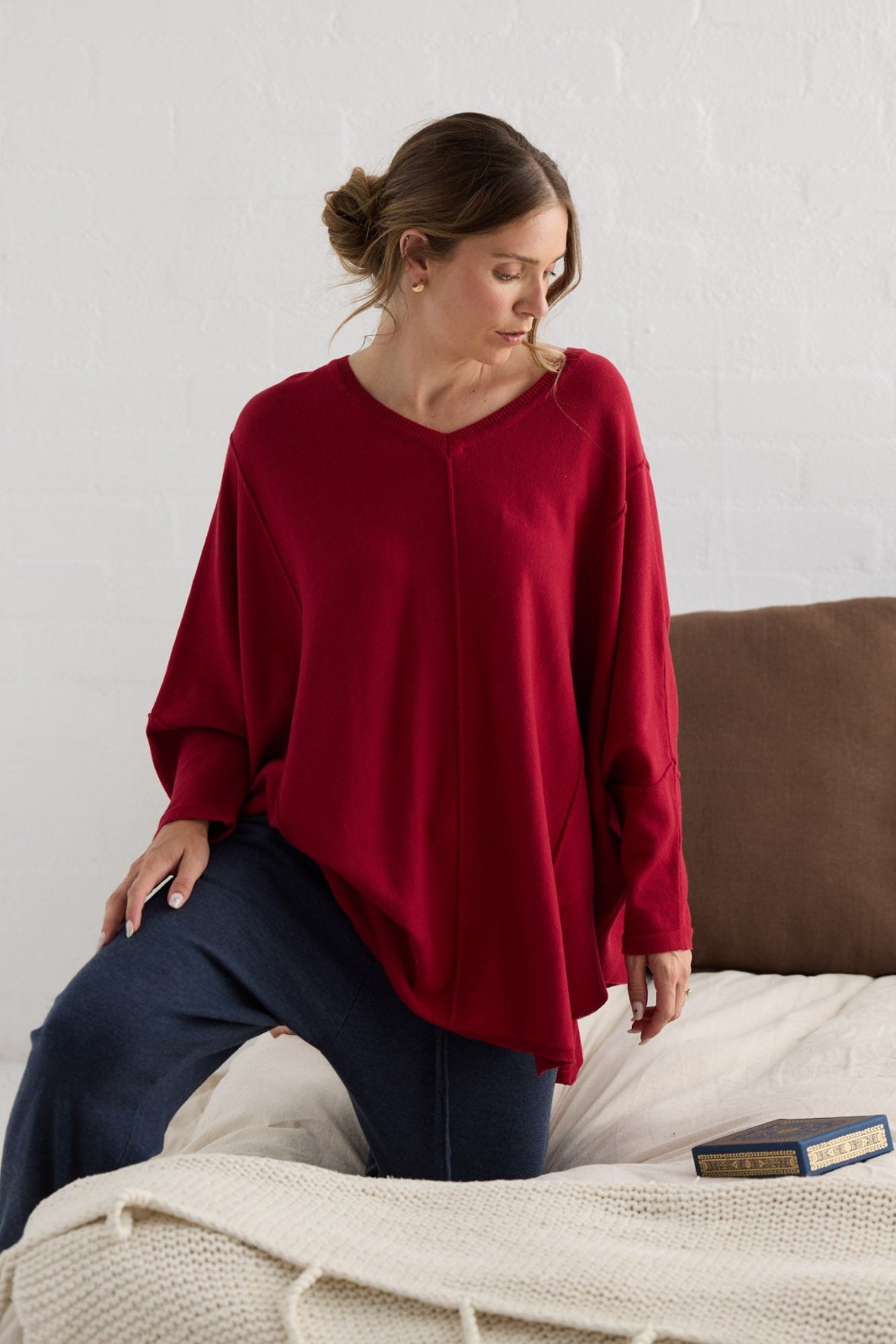 Campaign image of model wearing Chill Top in scarlet.