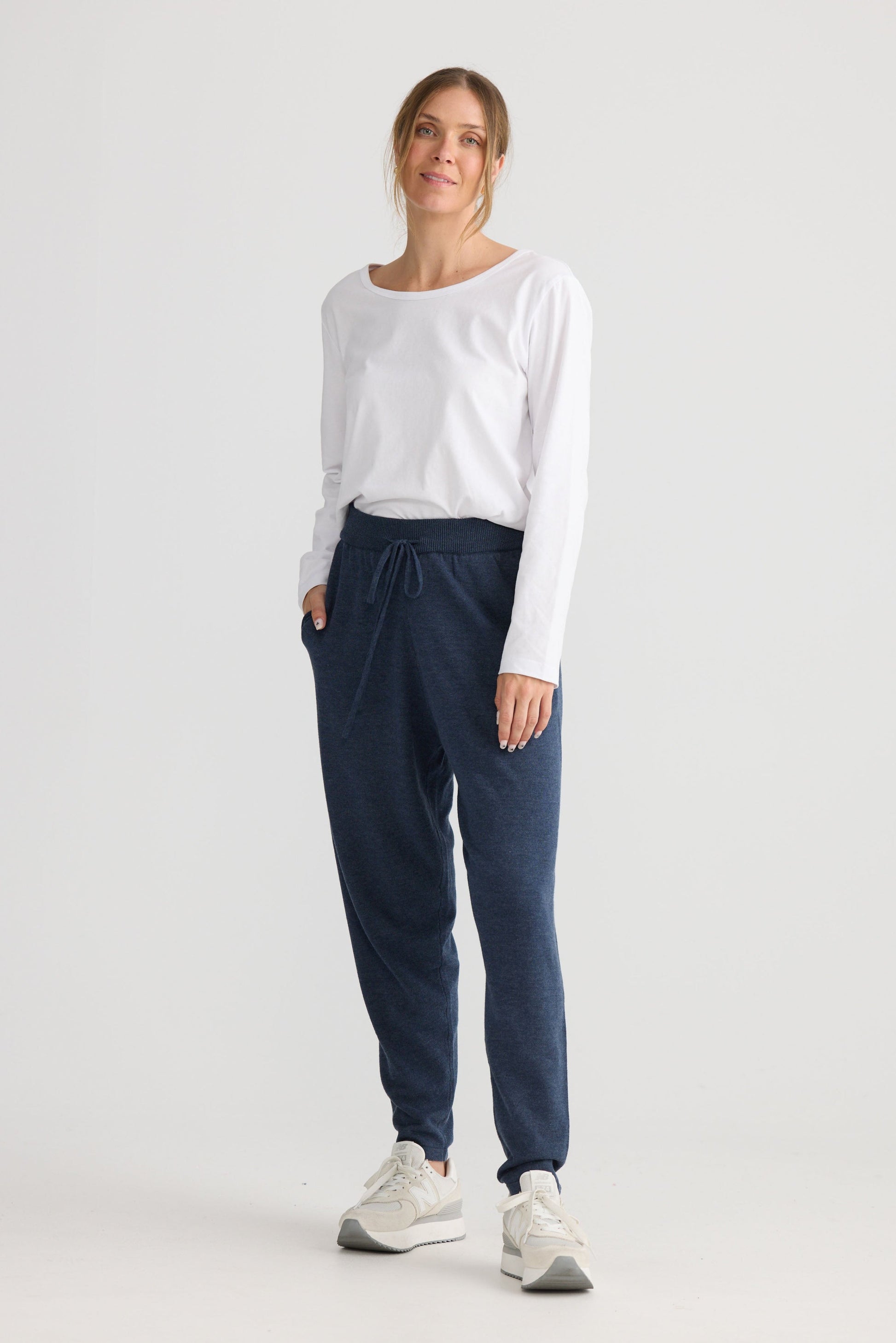 Model wearing Woodside Pant in navy.