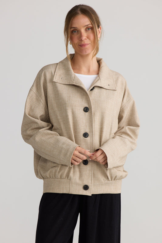 Model wearing Edie Jacket in stone, showing layered jacket shape.