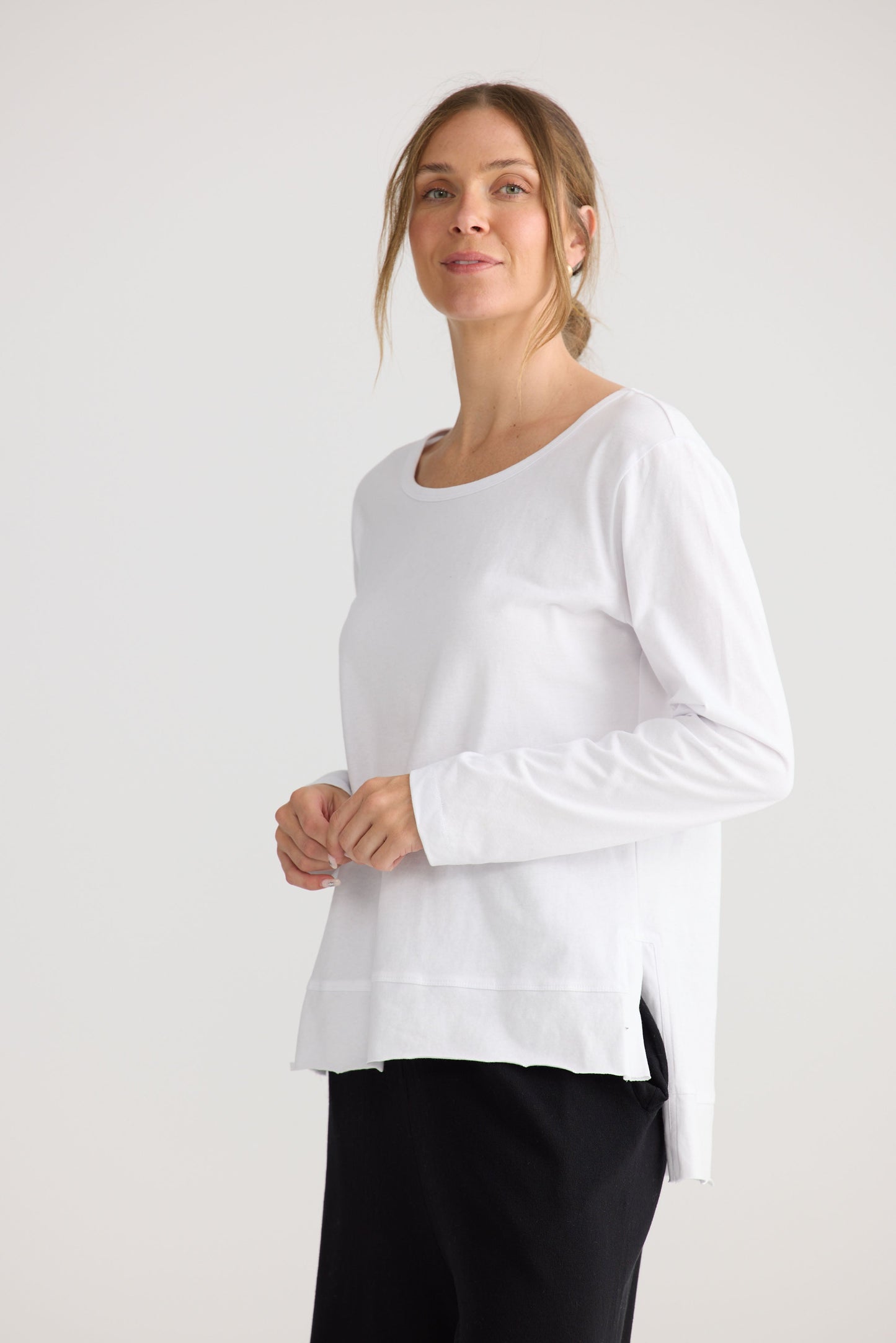Model wearing Faye Lounge Tee in white, styled for everyday wear.