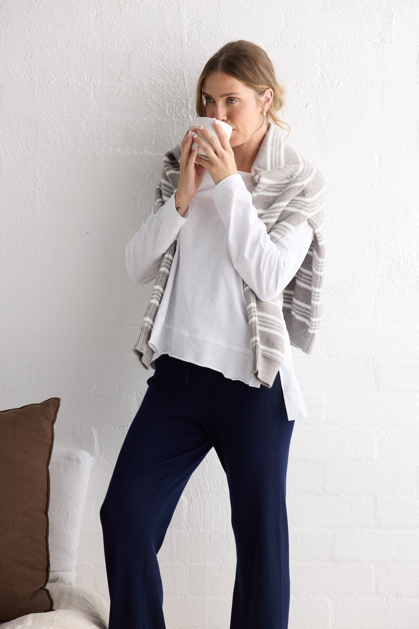 Campaign image of model wearing Faye Lounge Tee in white.
