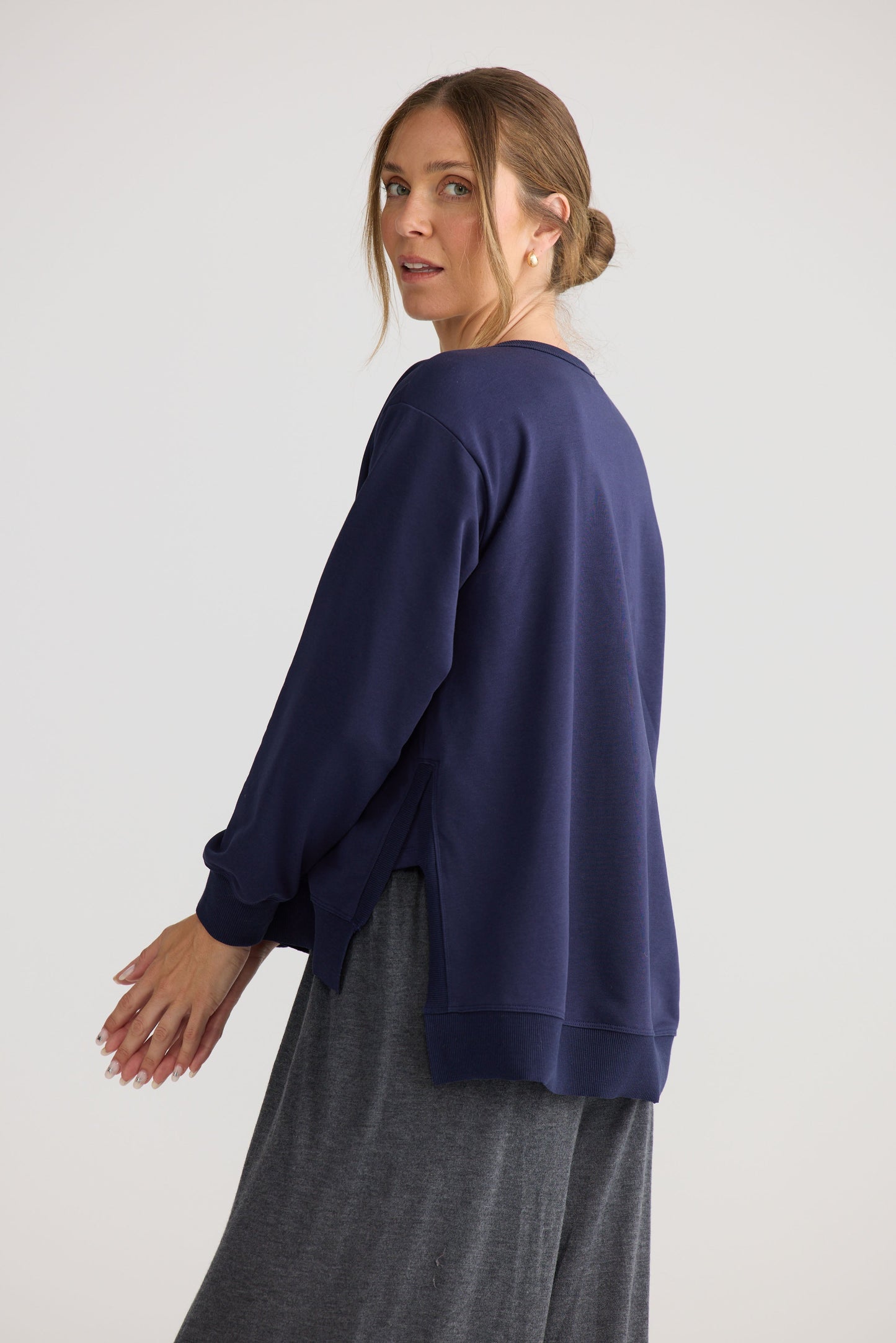Model wearing Faye Lounge Jumper in navy, styled for everyday wear.