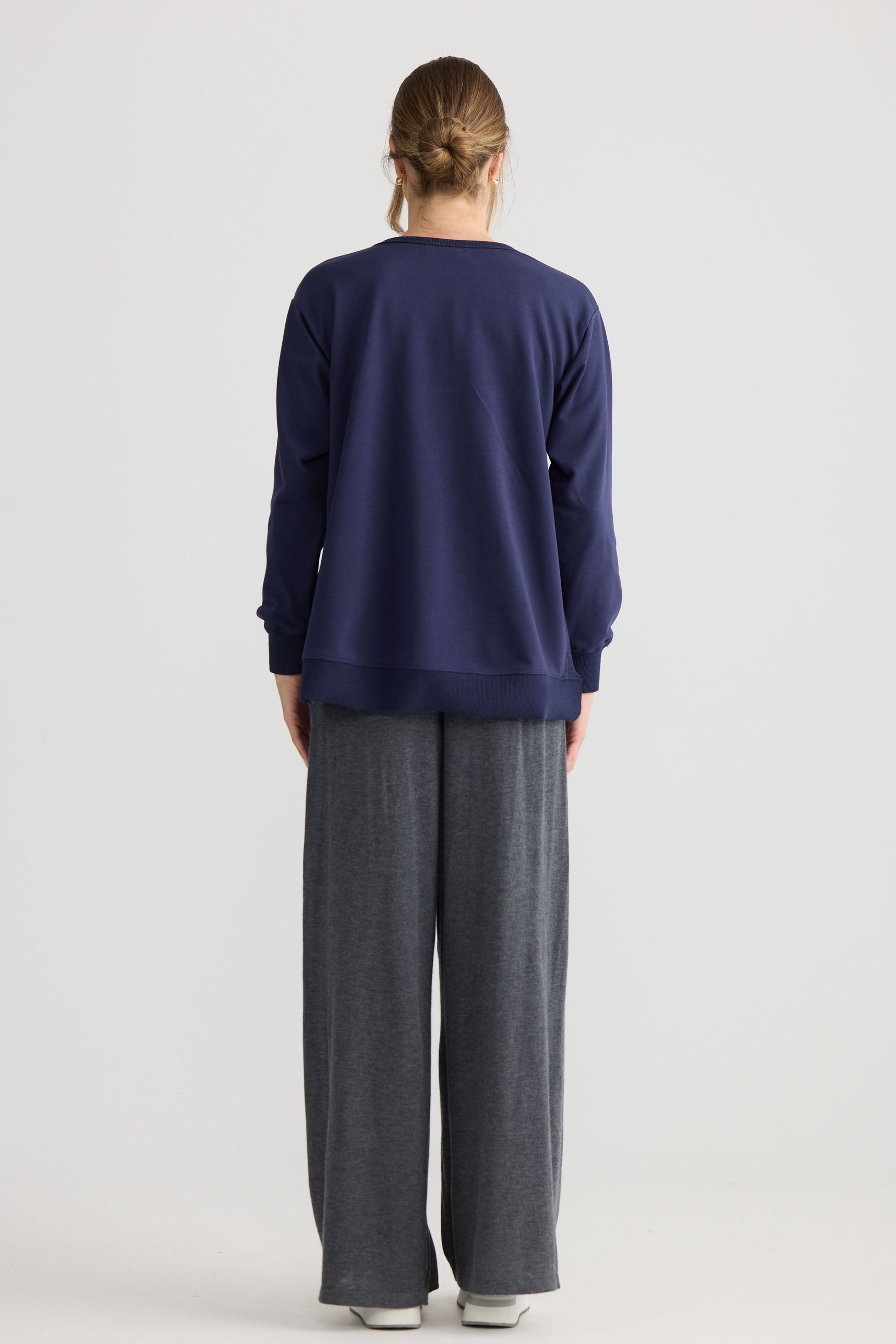 Faye Lounge Jumper in navy, shown on model.