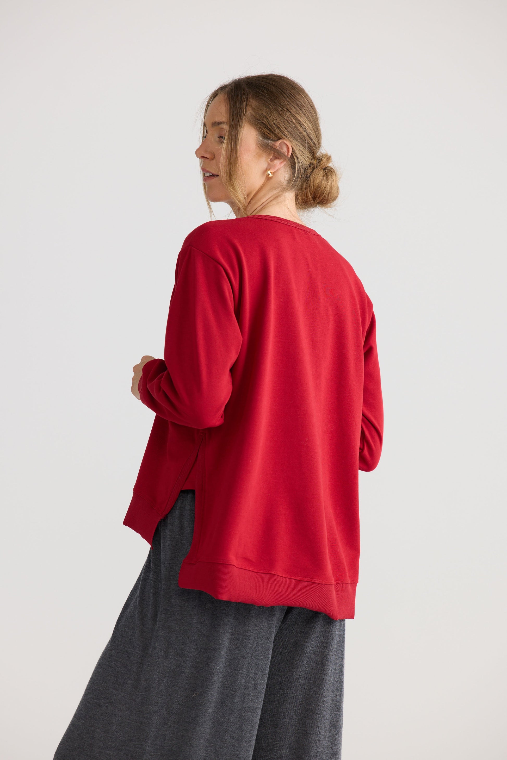 Faye Lounge Jumper in scarlet, shown on model.