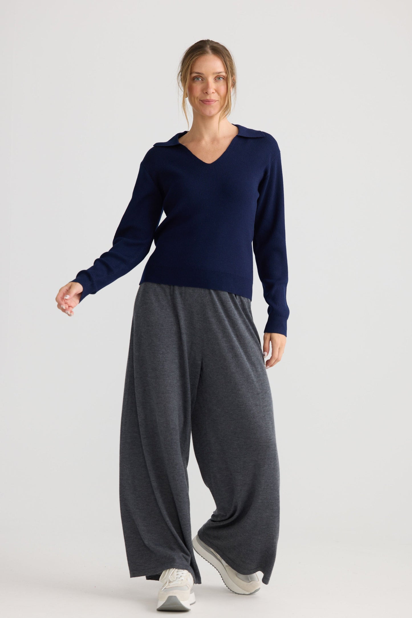 Model wearing Tilda Top in navy, styled for everyday wear.
