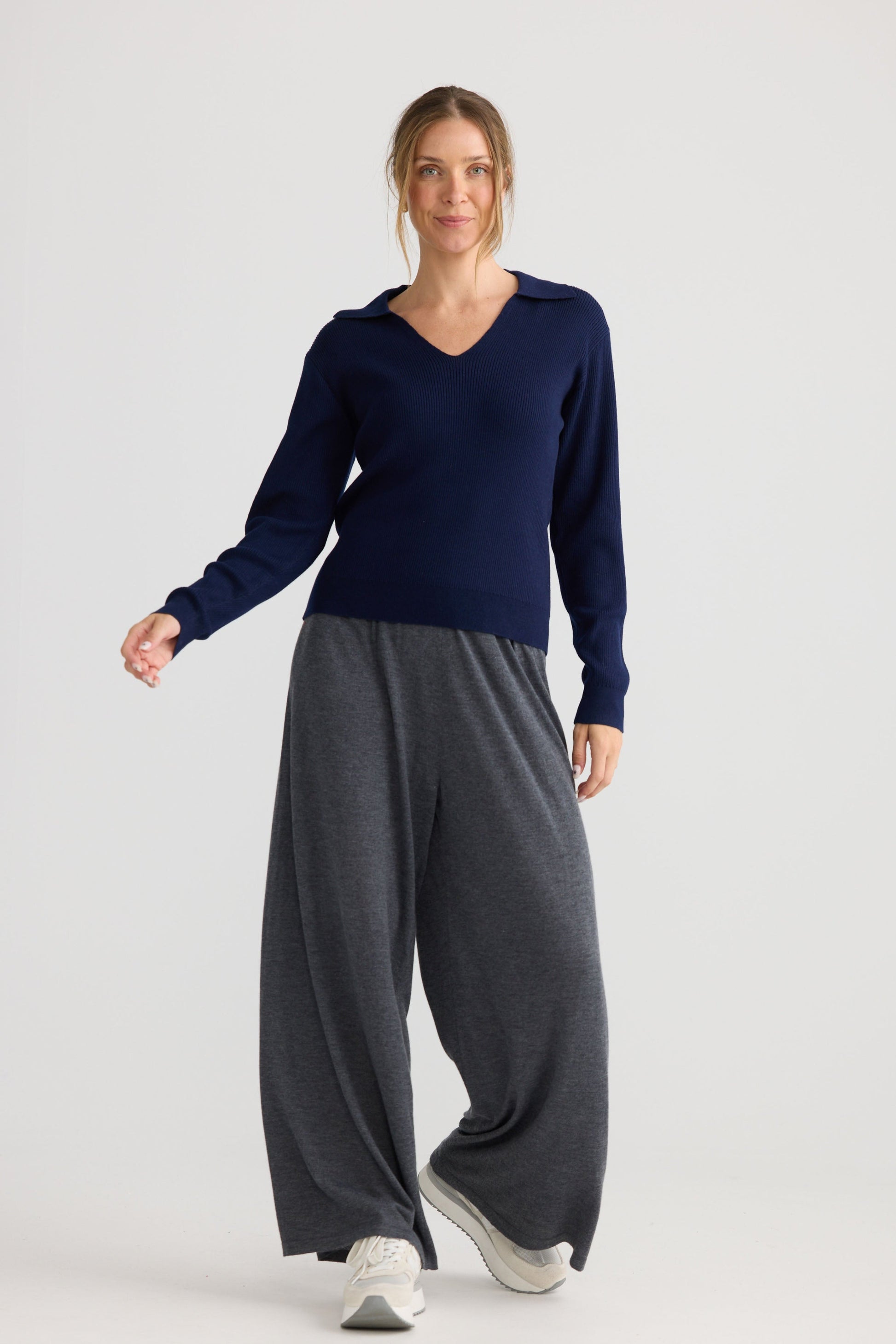 Model wearing Tilda Top in navy, styled for everyday wear.