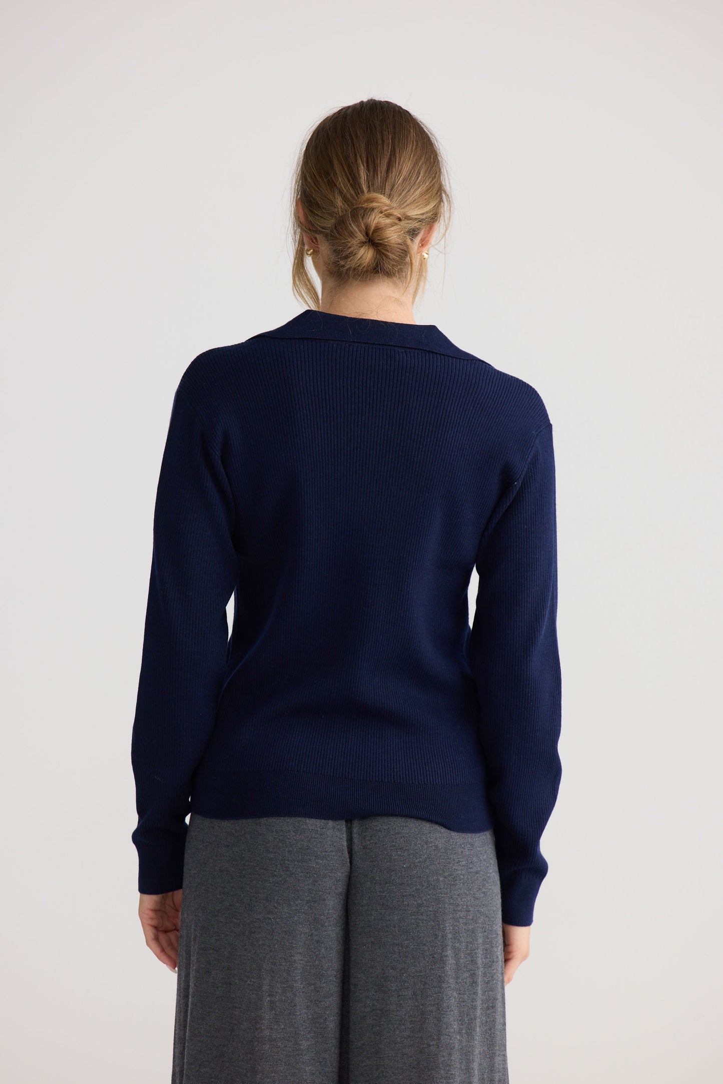 Model wearing Tilda Top in navy.