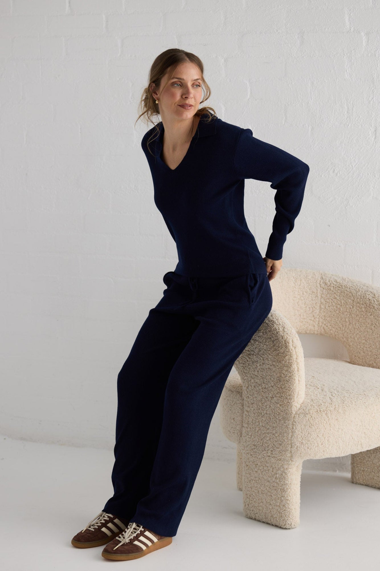 Campaign image of model wearing Tilda Pant in navy.