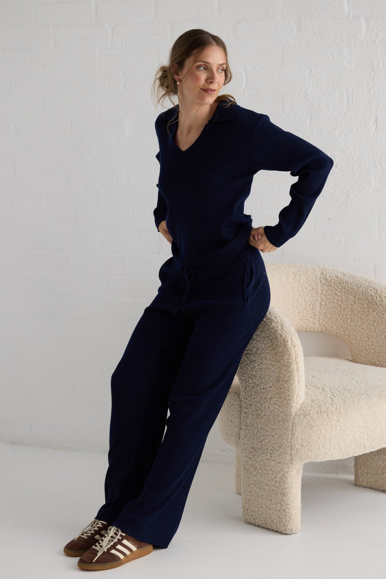 Campaign image of model wearing Tilda Top in navy.