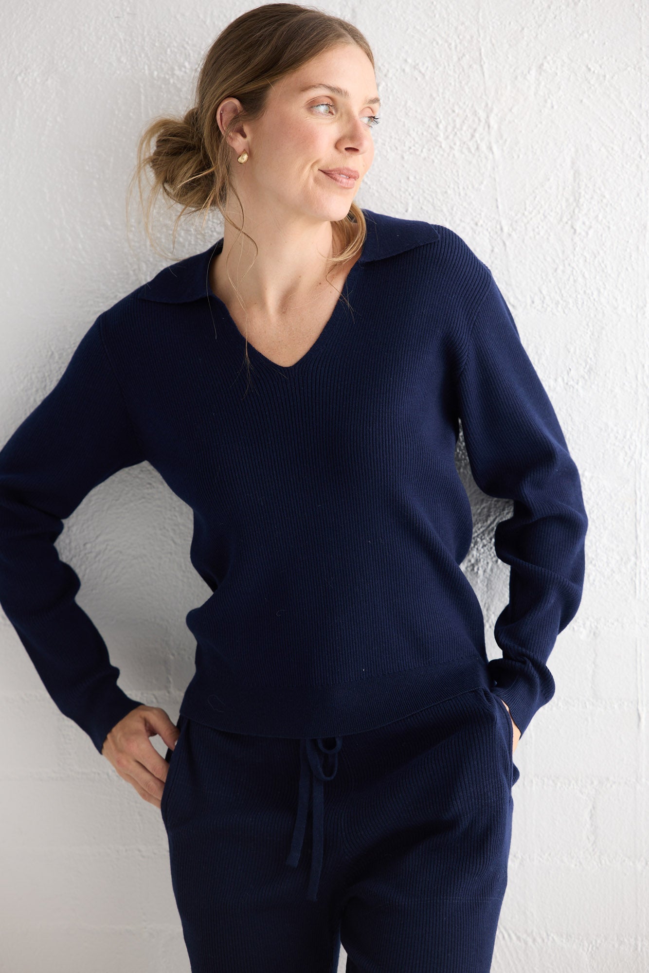 Campaign image of model wearing Tilda Pant in navy.