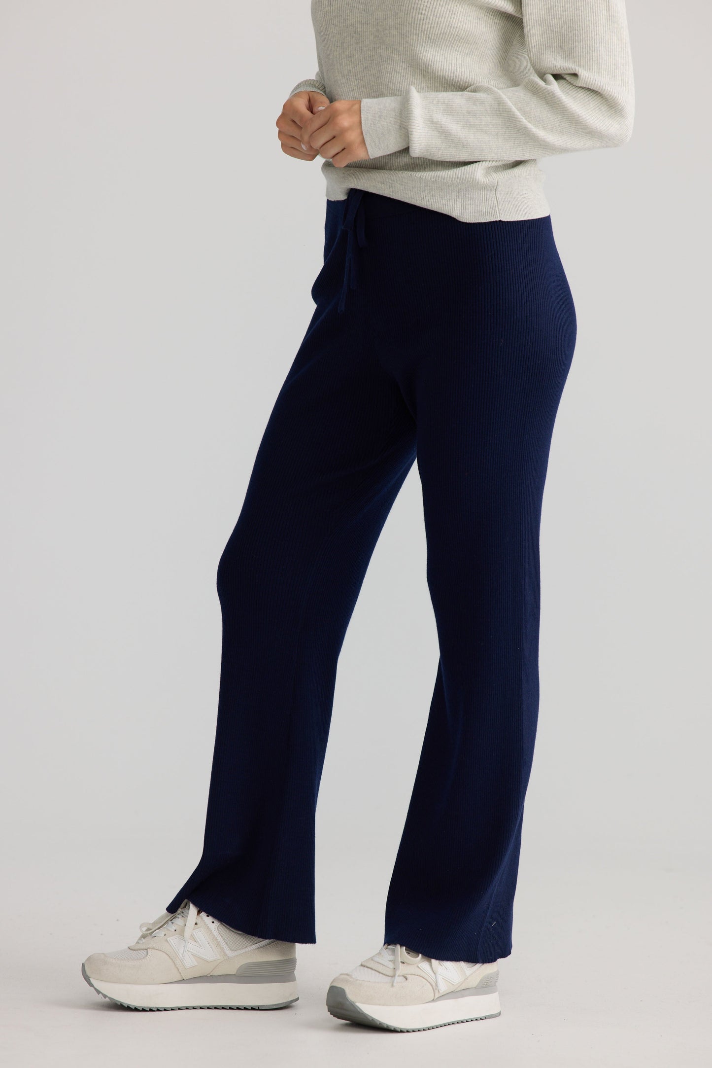 Model wearing Tilda Pant in navy, styled for everyday wear.