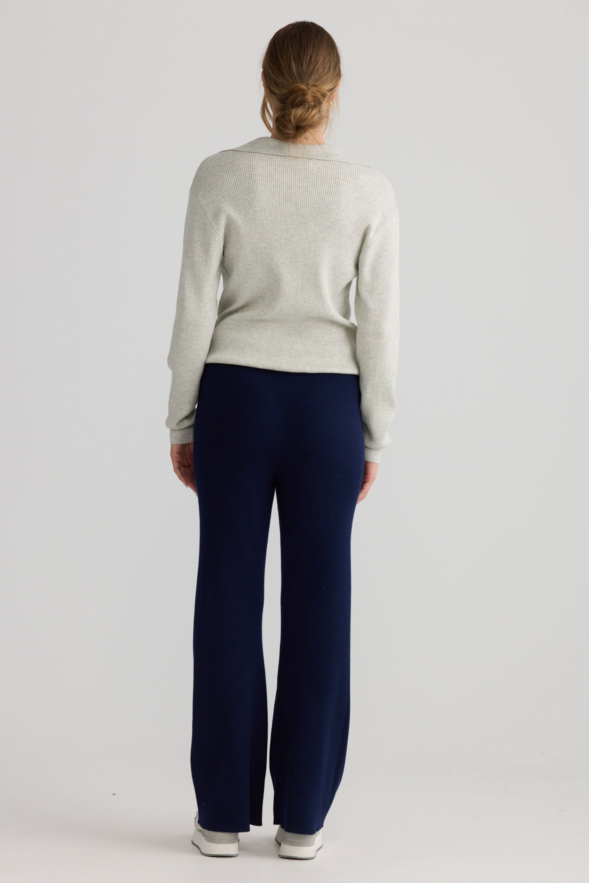 Model wearing Tilda Pant in navy, showing relaxed leg shape.