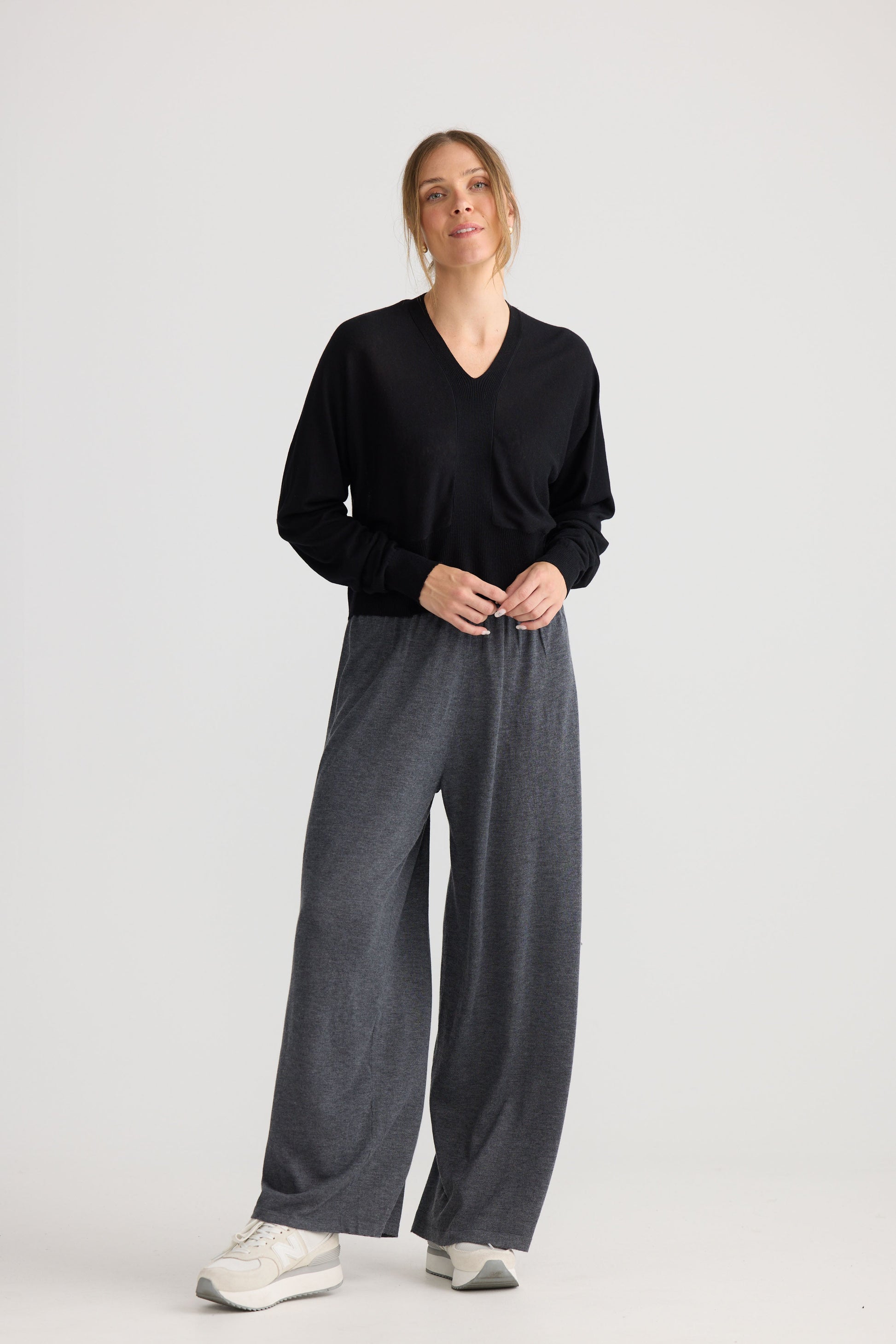 Model wearing Stillness Knit in black, styled for everyday wear.