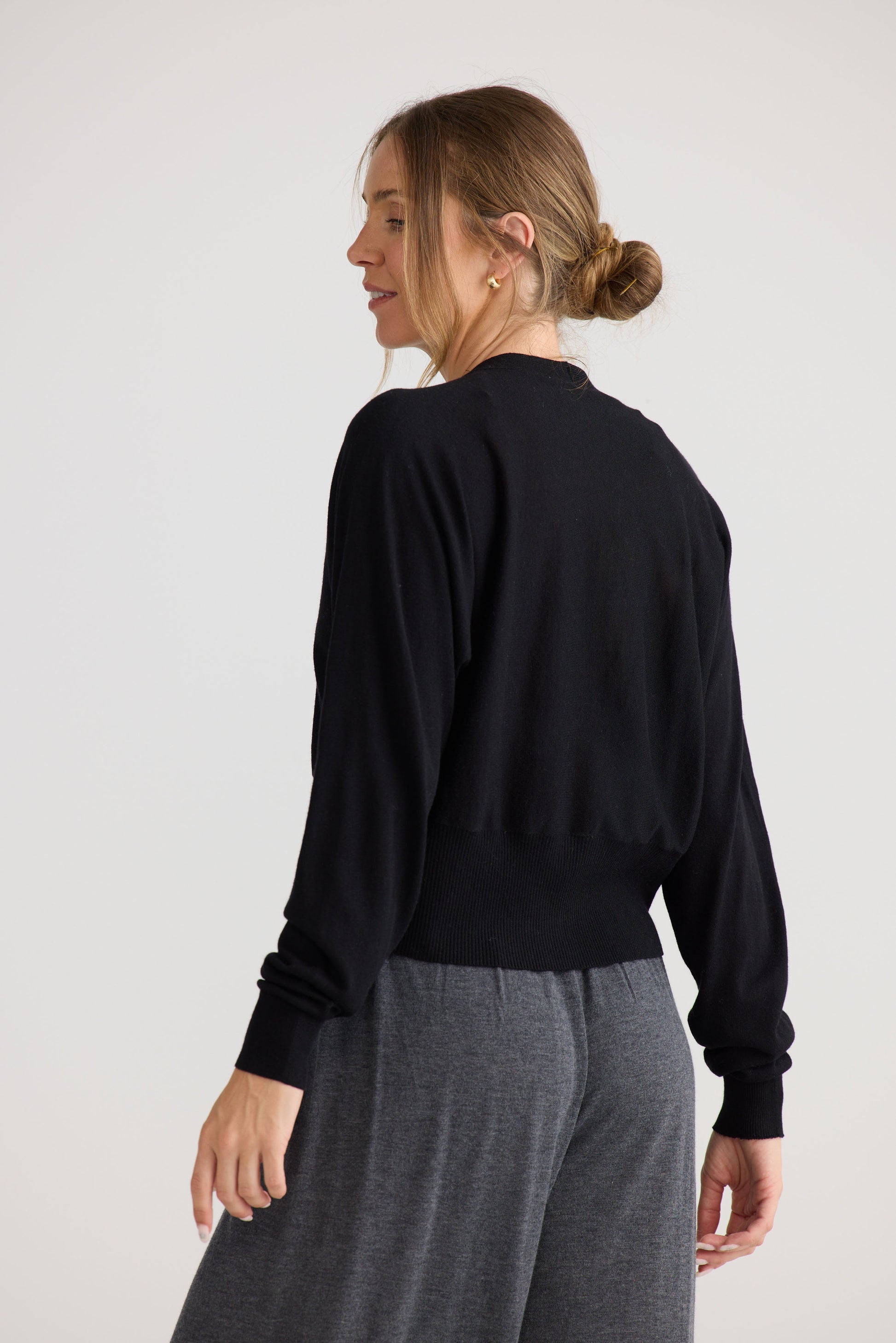 Stillness Knit in black, shown on model.