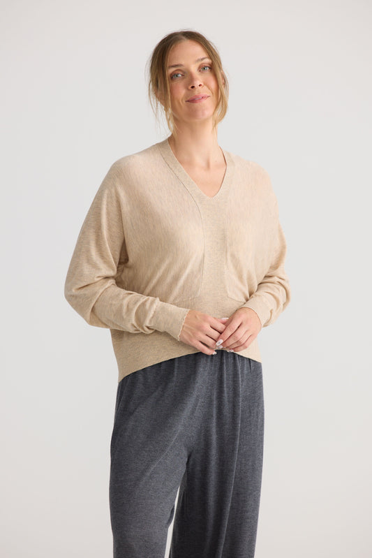 Model wearing Stillness Knit in oat.
