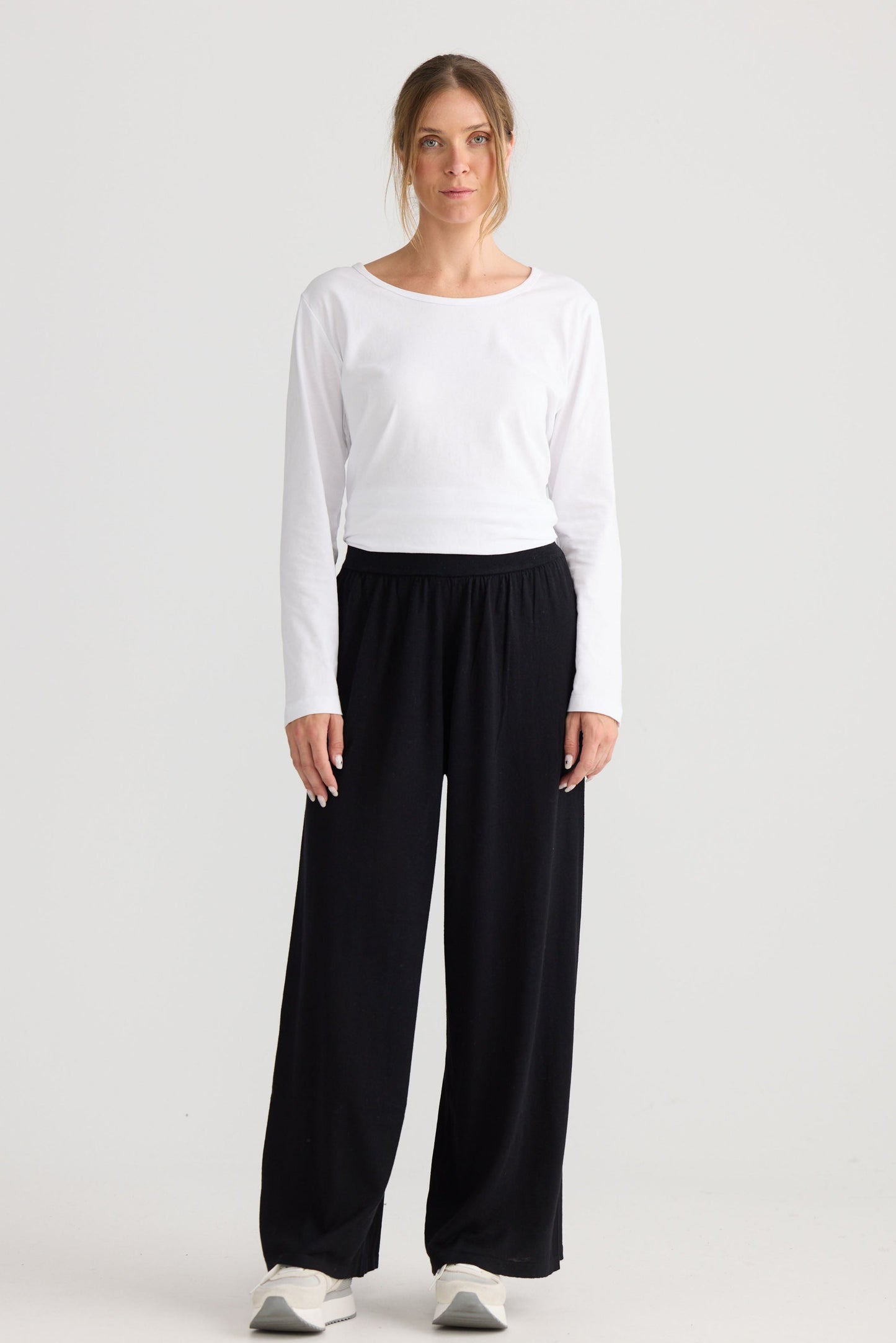 Stillness Knit Pant in black, styled with a relaxed outfit.