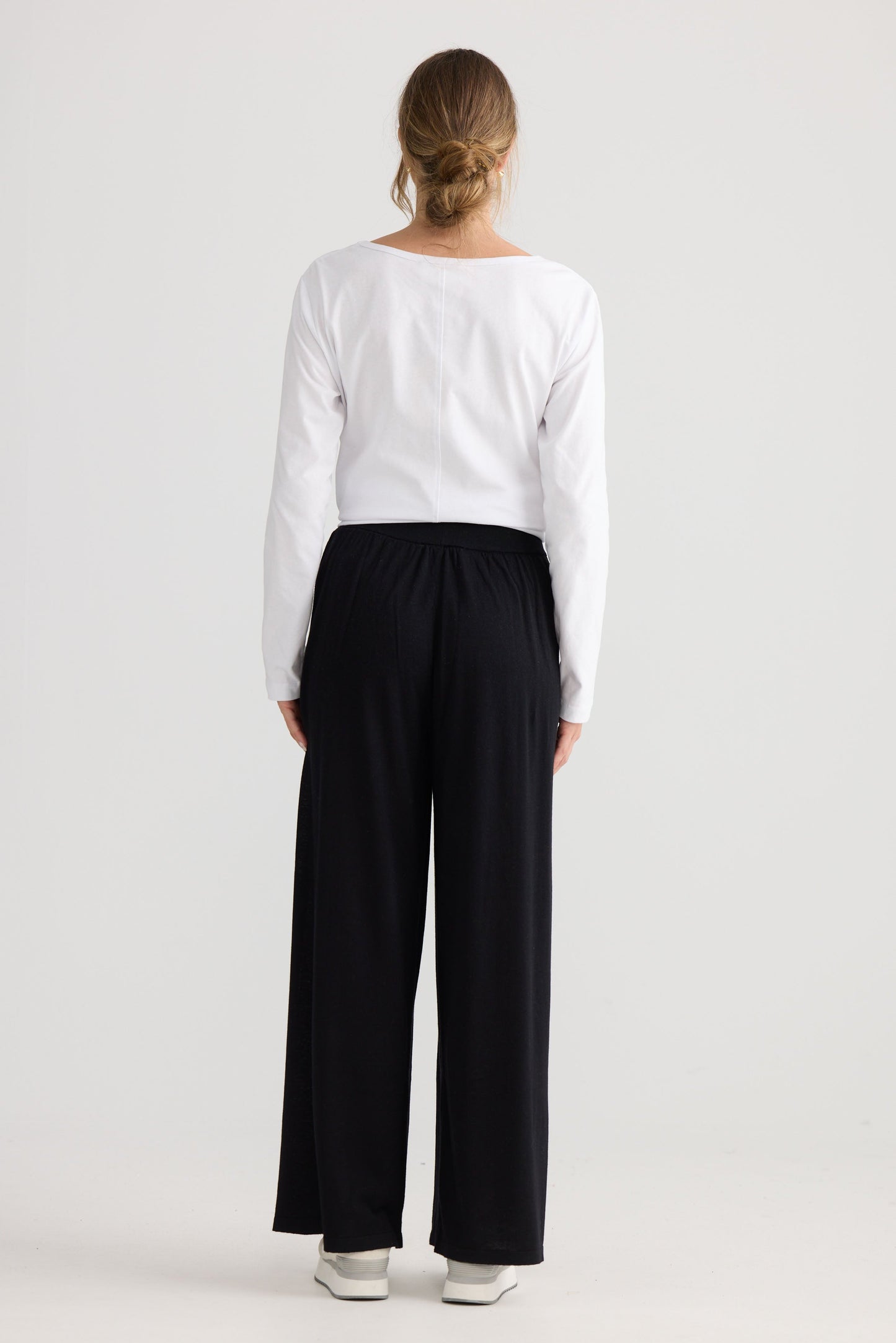 Stillness Knit Pant in black, showing relaxed leg shape.