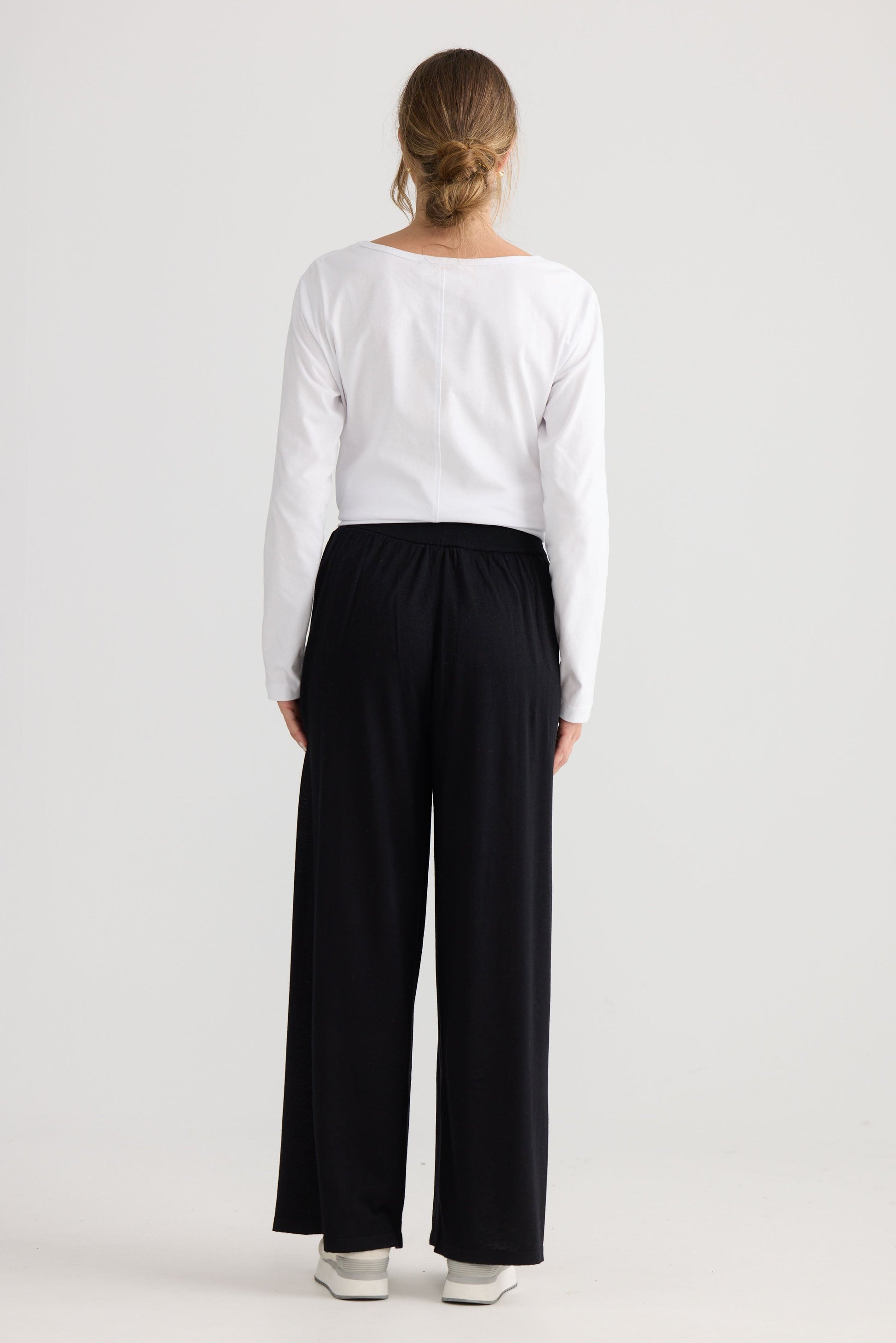 Stillness Knit Pant in black, showing relaxed leg shape.