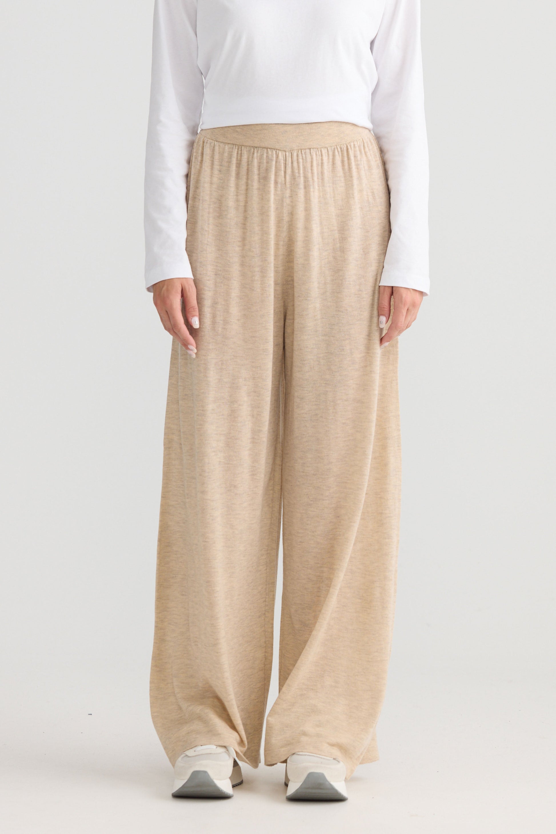Model wearing Stillness Knit Pant in oat, showing relaxed leg shape.