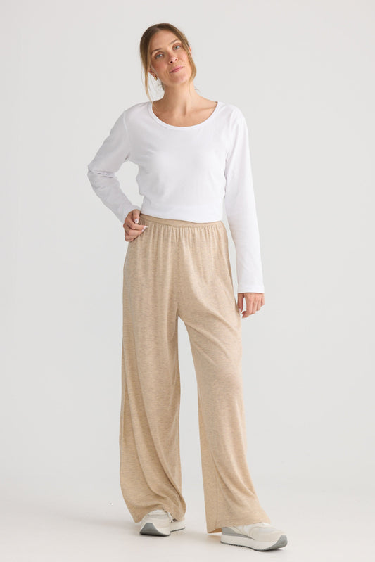 Model wearing Stillness Knit Pant in oat, styled for everyday wear.