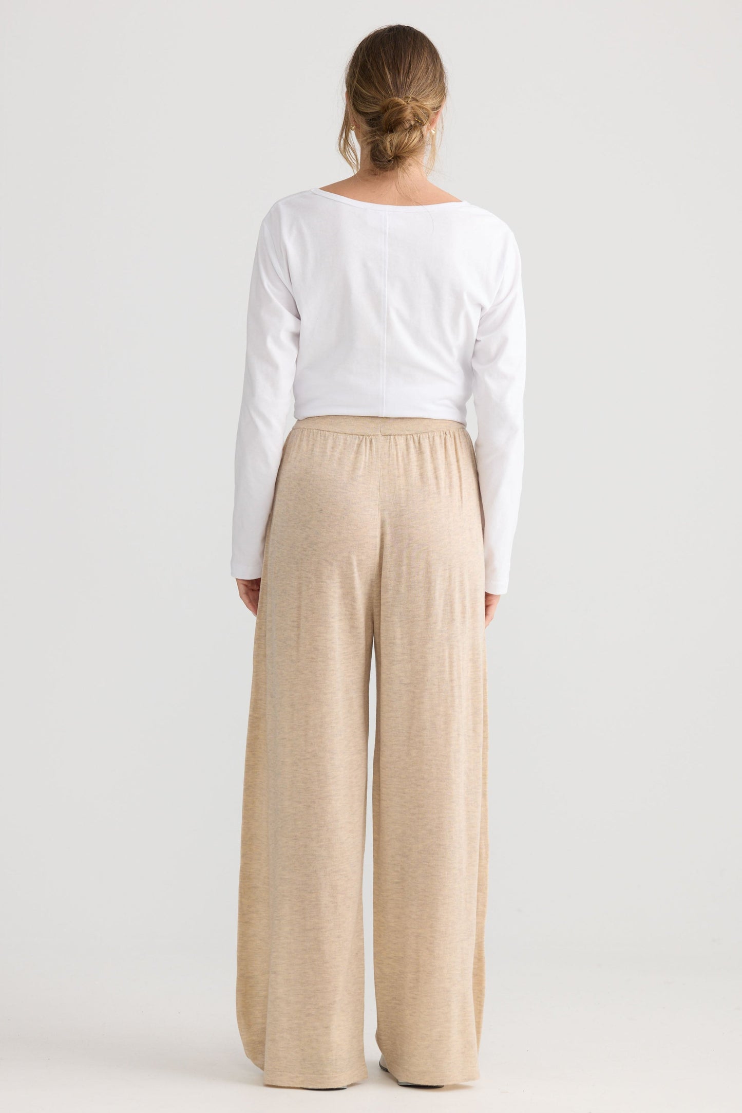 Model wearing Stillness Knit Pant in oat.