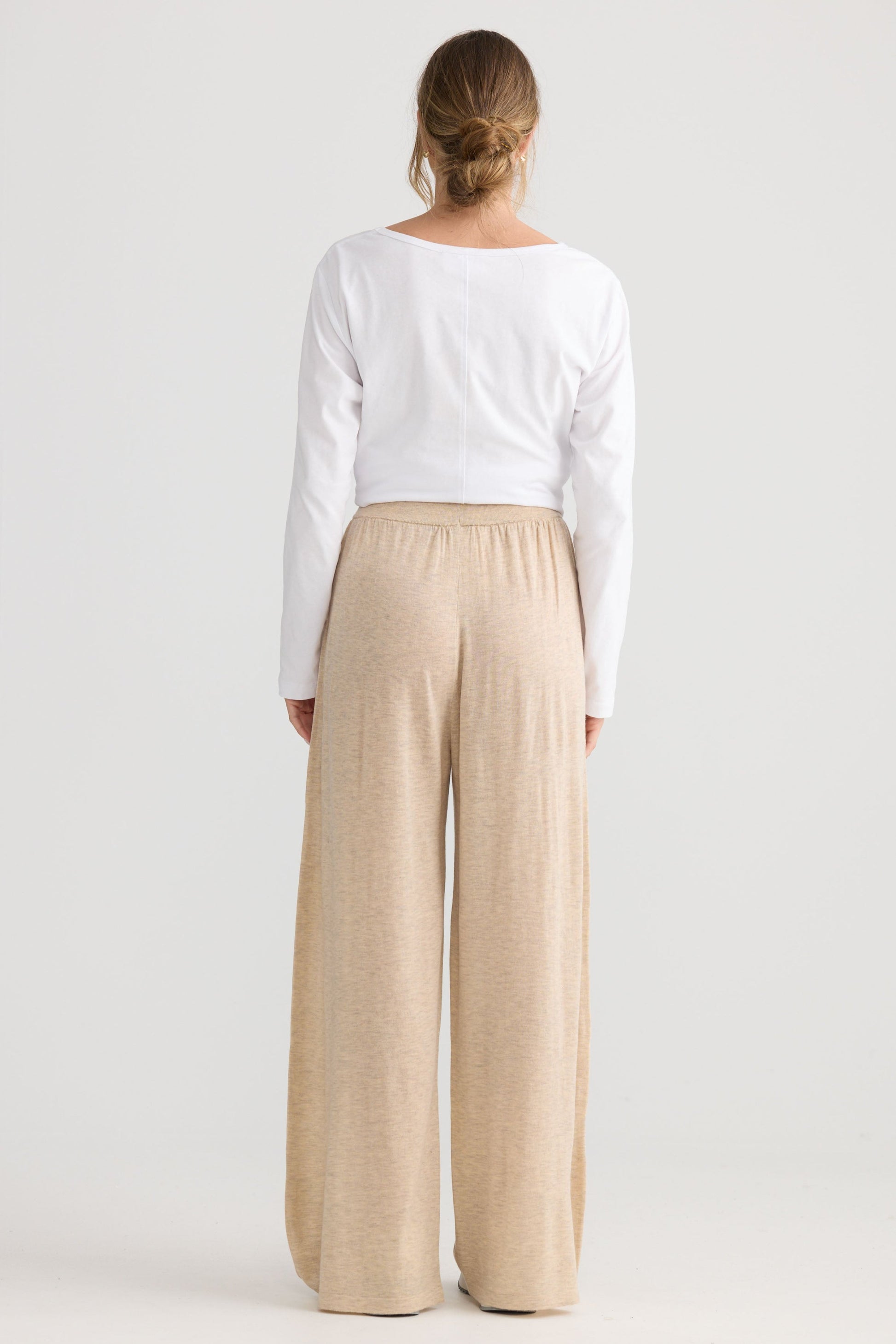 Model wearing Stillness Knit Pant in oat.