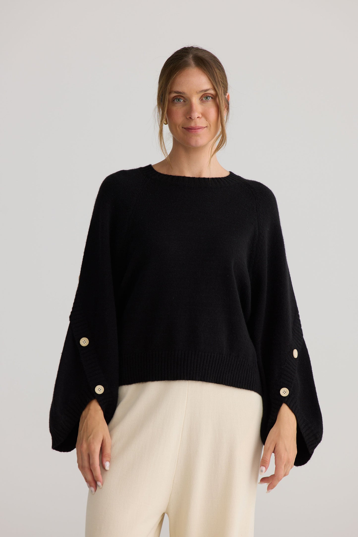 Model wearing Horizon Knit in black.