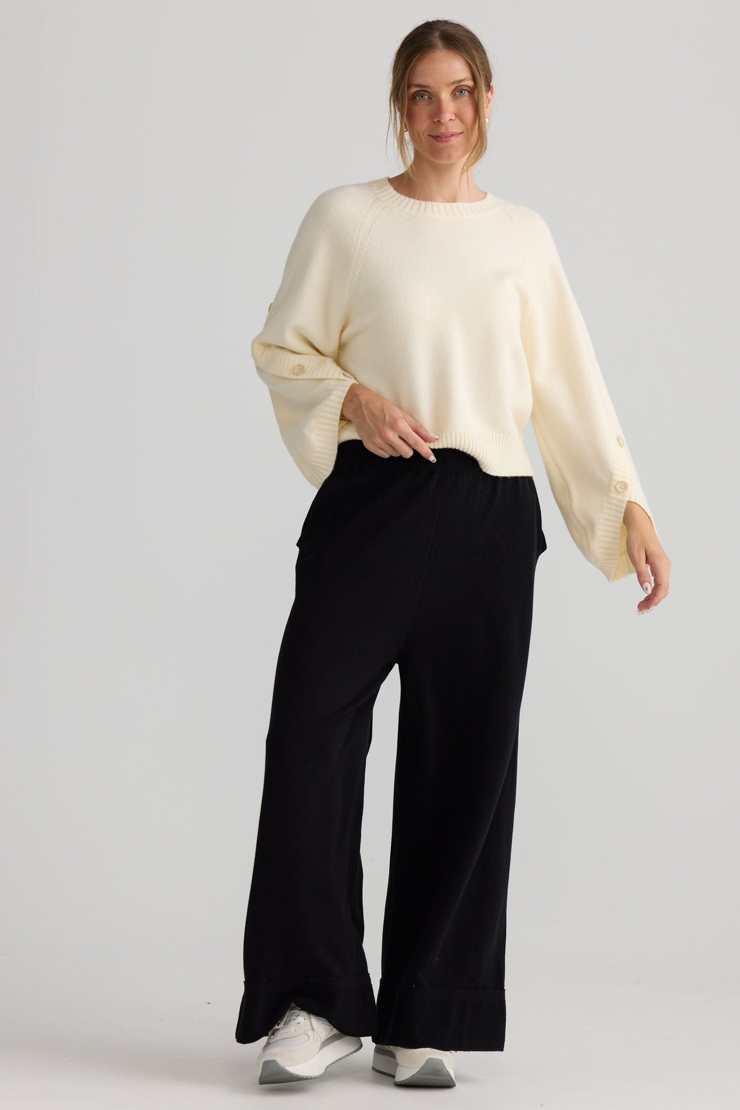 Awaken Knit Pant in black, showing relaxed leg shape.
