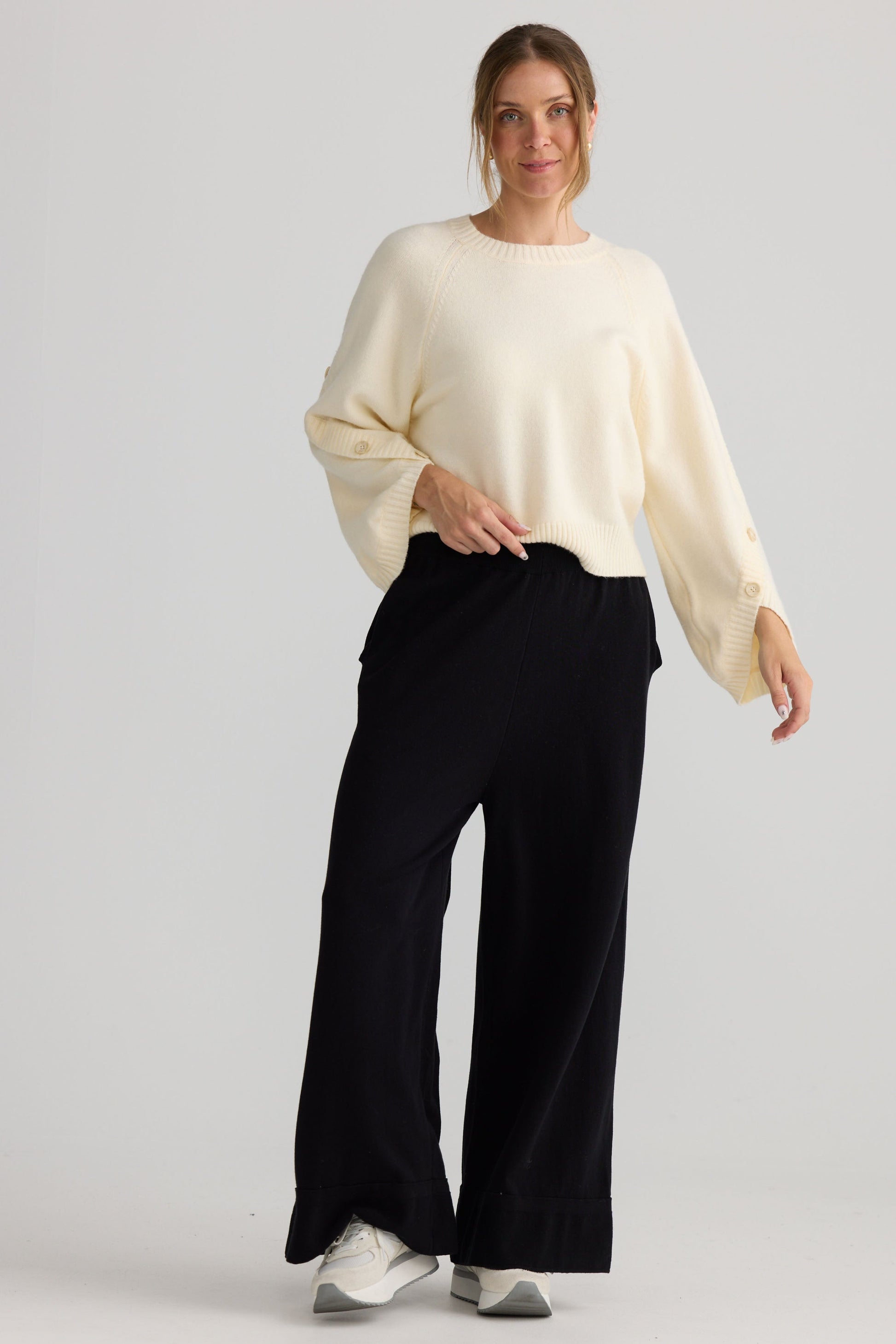 Awaken Knit Pant in black, showing relaxed leg shape.