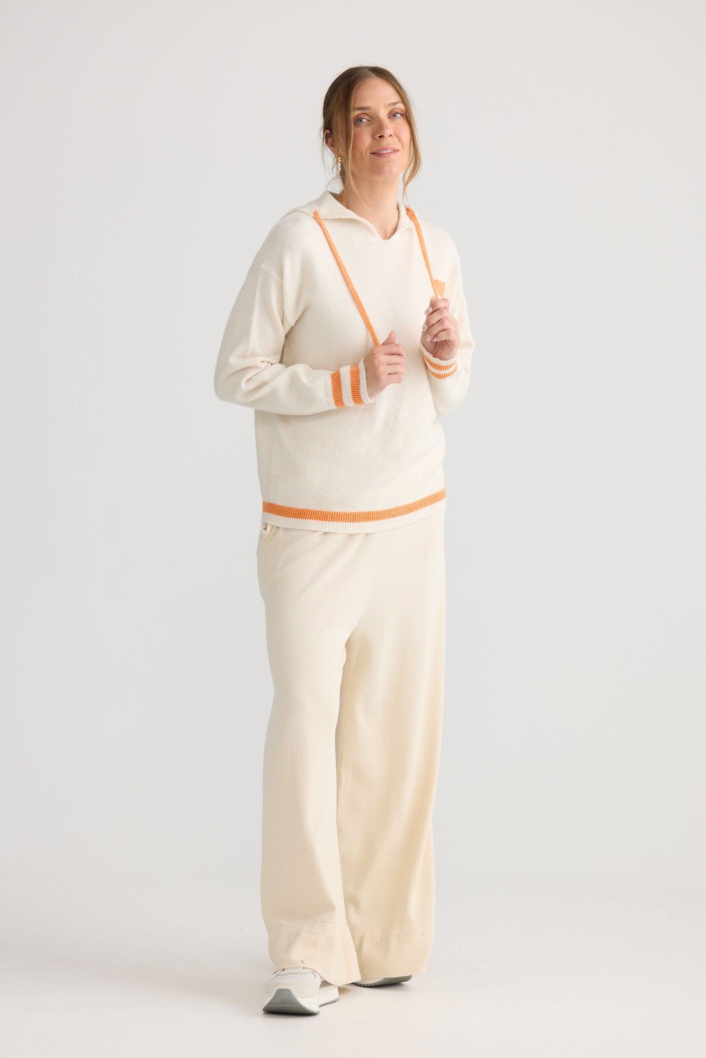 Bold Hearts Hoodie in off white, showing hooded knit shape.