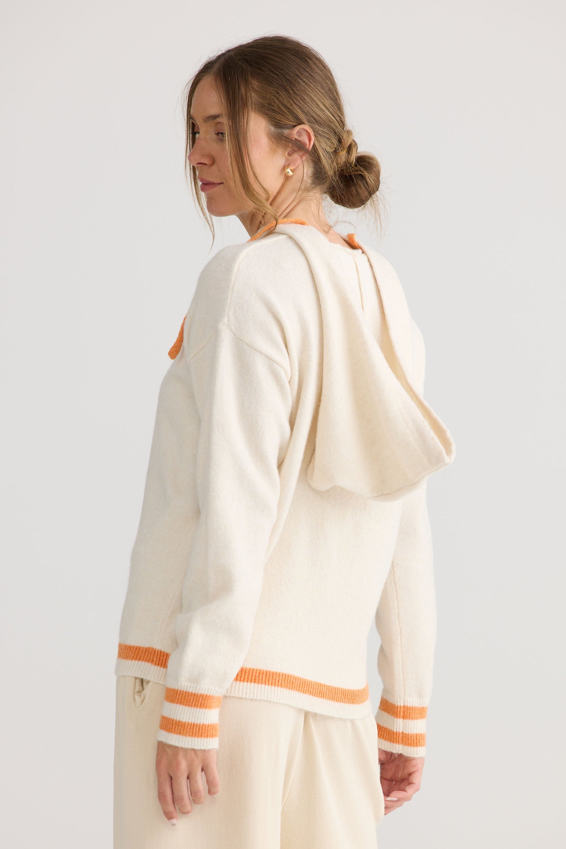 Bold Hearts Hoodie in off white, shown on model.